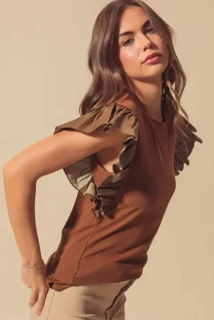 Cinnamon Ruffle Blouse – Chic Leather Sleeve Statement