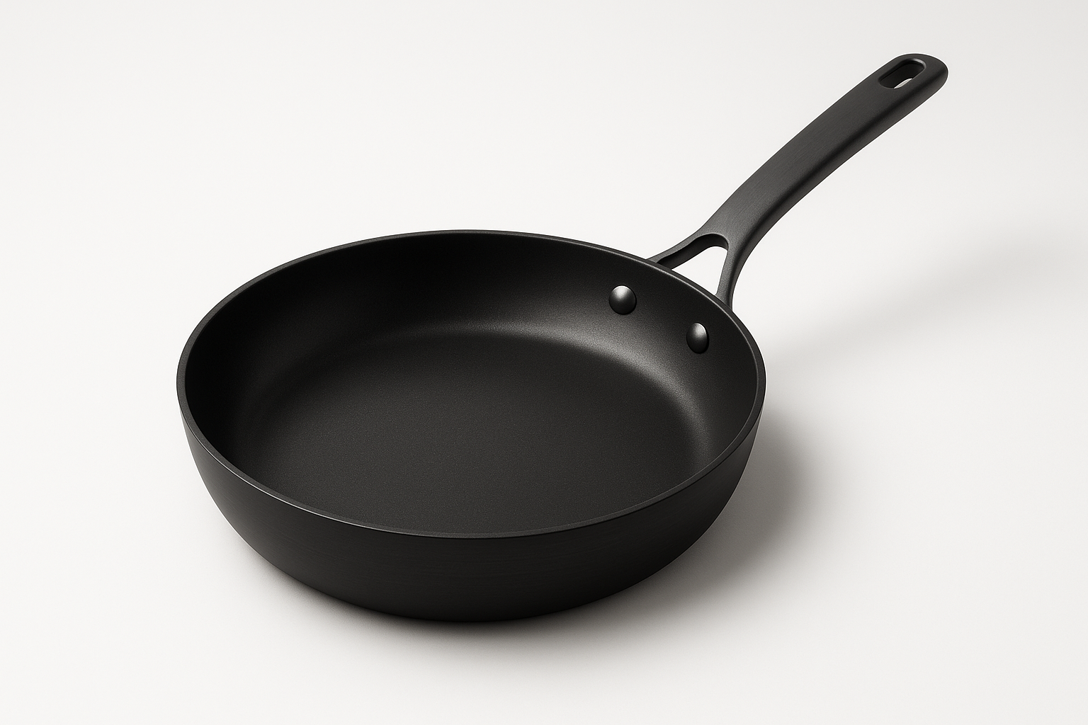 Kitchen essential engineered for daily performance and easy care. Built for durability, safety, and clean design.

Material: Hard‑anodized aluminum
Care: Hand wash; avoid metal utensils
Best for: Eggs, searing, sautéing
PFOA‑free 3‑layer nonstick
Oven safe to 200°C
Riveted stay‑cool handle

Matte black Colour