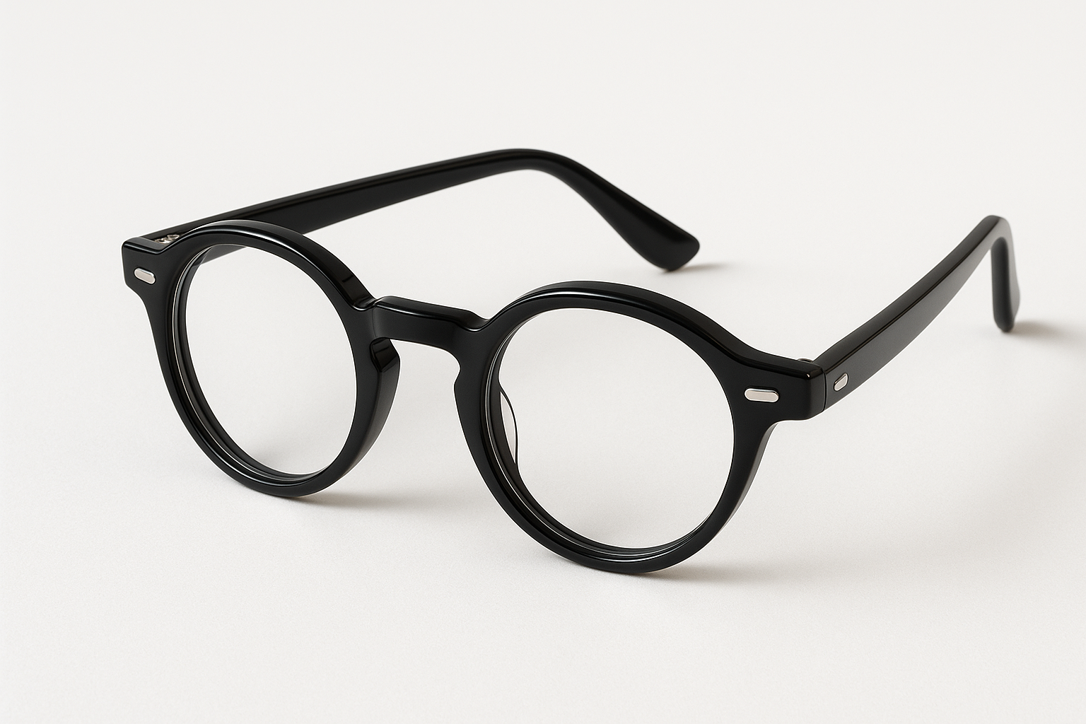 Studio product photo of UrbanEdge Round Acetate Premium eyeglasses in deep glossy black acetate, perfectly round frame with smooth edges and polished stainless steel core. Displayed on clean white background with soft daylight and minimal shadows. Highlight smooth hinge design, optical-ready lenses with subtle reflections, and high-end finish. Ultra-realistic, premium e-commerce product photography, --ar 1:1 --v 6 --style raw. Black Color